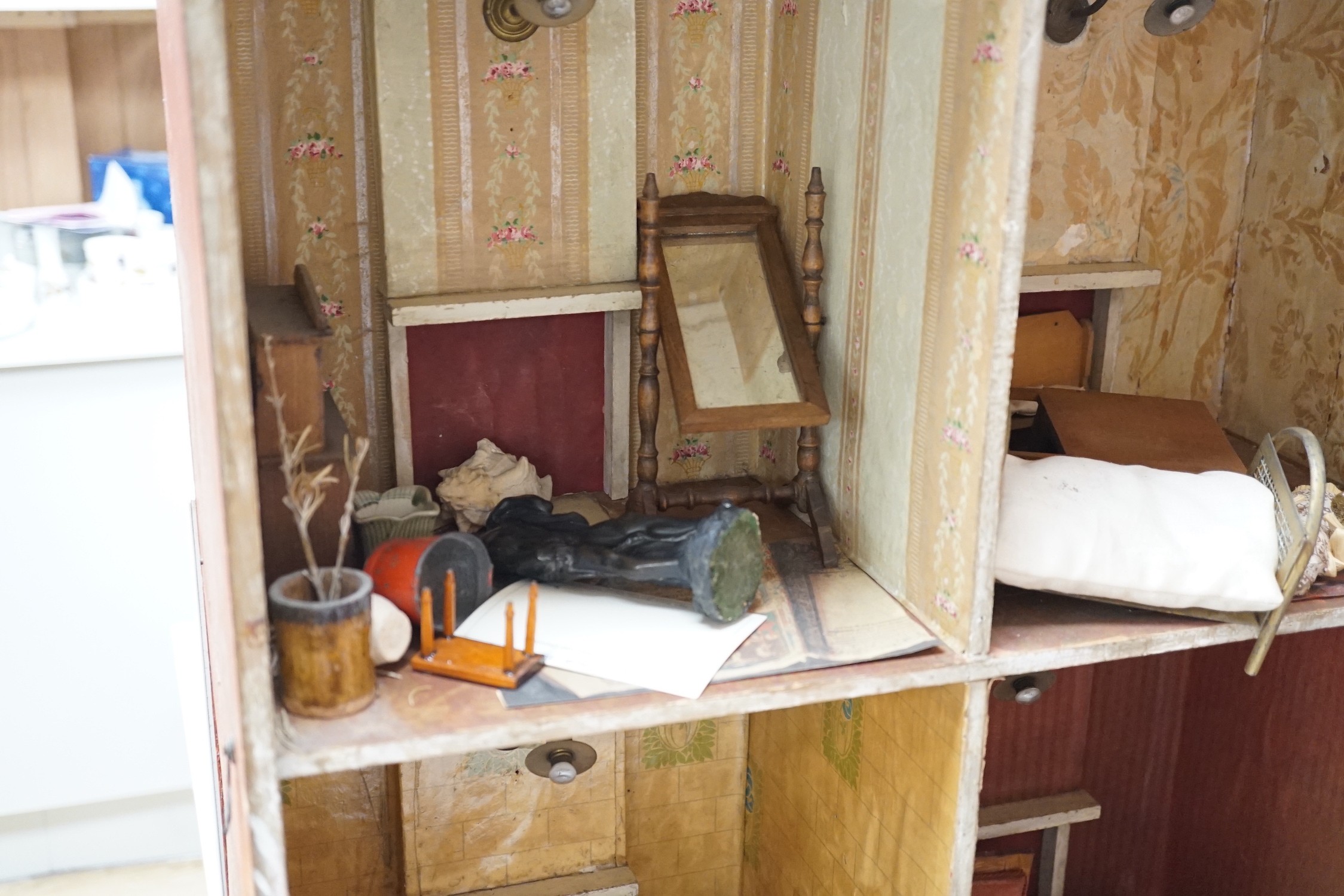 ‘Heiress House’: A commercially made London ‘boxback’ dolls’ house, late 19th century, 56cms wide x 68cms high